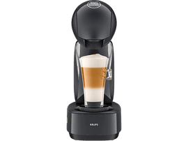 Cafetière Krups noire avec un verre de café en couches. Sur socle noir, bouton d