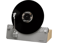 Charger l&#39;image dans la galerie, Disque vinyle noir jouant sur une platine vintage grise et bois.
