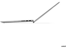 Charger l&#39;image dans la galerie, Un ordinateur portable gris, vue latérale, avec l&#39;écran ouvert, la charnière est visible, logo AMD.
