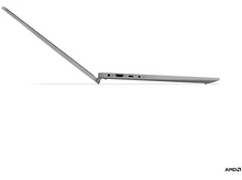 Charger l&#39;image dans la galerie, Un ordinateur portable argenté, ouvert, de côté, affichant un écran blanc.
