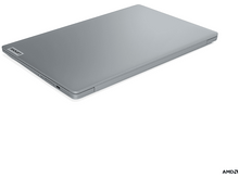 Charger l&#39;image dans la galerie, Un ordinateur portable argenté fermé sur fond blanc, avec le logo Lenovo visible.
