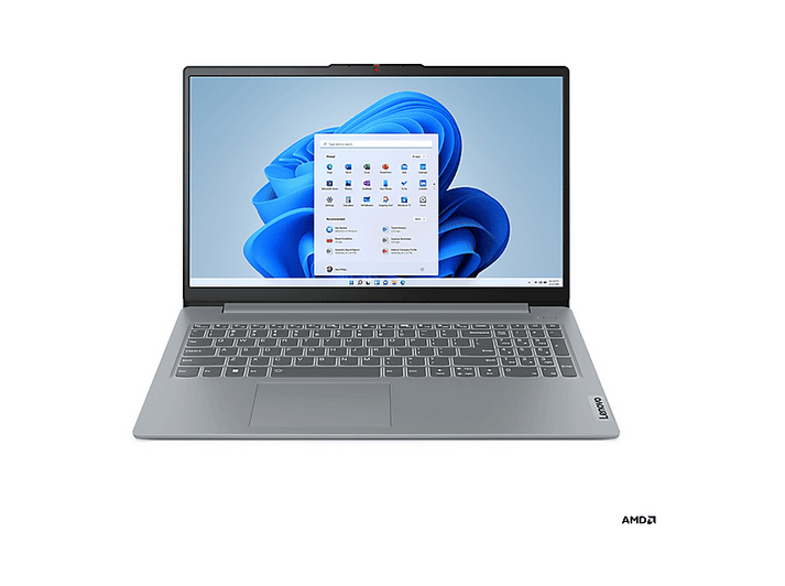Un ordinateur portable Lenovo est ouvert, affichant l'écran d'accueil de Windows 11. Le clavier est visible. Logo AMD en bas à droite.