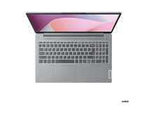 Charger l&#39;image dans la galerie, Un ordinateur portable Lenovo gris est ouvert. L&#39;écran affiche un motif abstrait rose clair et blanc. Le clavier est visible et le logo AMD est en bas.
