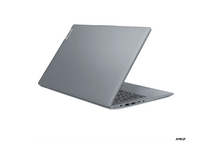 Charger l&#39;image dans la galerie, Un ordinateur portable Lenovo gris est légèrement ouvert, montrant le clavier et les ports. Le logo Lenovo est visible. Fond blanc.
