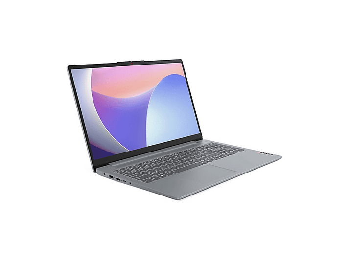 Un ordinateur portable Lenovo gris est ouvert sur une surface blanche. L'écran affiche un design abstrait coloré. Le clavier est visible.