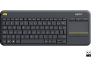 Clavier sans fil gris foncé avec pavé tactile et touches de fonction. Un récepteur USB est également visible.