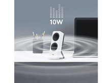 Charger l&#39;image dans la galerie, Enceintes blanches avec une base noire et deux trous pour haut-parleurs, sur un bureau blanc.
