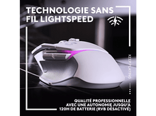 Charger l&#39;image dans la galerie, Une souris de jeu blanche avec des boutons latéraux, éclairée en rose et violet. La souris est sur une surface sombre.
