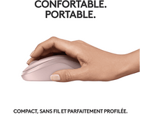 Charger l'image dans la galerie, Une main tient une souris rose. Texte : Confortable. Portable. Compact, sans fil et parfaitement profilé.
