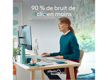 Charger l'image dans la galerie, Femme travaillant à un bureau, texte : 90% de bruit de clic en moins.
