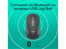 Charger l'image dans la galerie, Souris Logitech noire sur fond bleu avec symboles Bluetooth et récepteur USB.
