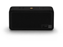 Charger l&#39;image dans la galerie, Haut-parleur noir sur une surface blanche, avec quelques ports de connexion sur le côté.
