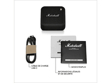 Charger l&#39;image dans la galerie, Un haut-parleur portable noir avec accessoires.
