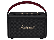 Charger l&#39;image dans la galerie, Un haut-parleur Marshall noir avec une poignée rouge. Il a des boutons dorés sur le dessus et la marque est visible.
