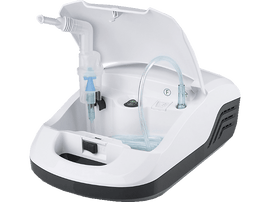 Nébuliseur blanc avec couvercle ouvert, tubes et embout buccal. Fond violet.