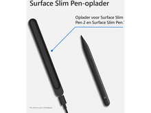 Charger l&#39;image dans la galerie, Stylet Surface Slim noir et chargeur. Le stylet est à côté de la base de chargement.
