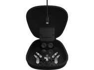 Étui noir ouvert avec des composants de contrôleur. Comprend des boutons, des sticks et un port de charge.