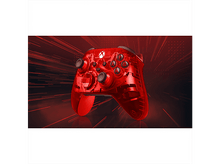 Charger l&#39;image dans la galerie, Une manette Xbox rouge transparente est centrée. Le fond est rouge foncé avec des stries claires. La manette a des boutons noirs.
