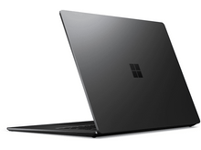 Charger l&#39;image dans la galerie, Ordinateur portable noir légèrement ouvert. Logo Microsoft visible à l&#39;arrière. Sur fond blanc.
