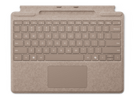 Un protège-clavier beige avec des touches étiquetées. Un pavé tactile en bas. Texture semblable à du feutre.