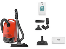 Charger l&#39;image dans la galerie, Aspirateur orange avec accessoires, sac et accessoires, sur fond blanc.
