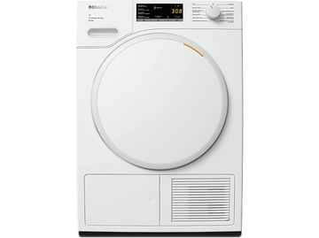 Sèche-linge Miele blanc. Il a une porte ronde avec un petit écran. Un panneau de commande est au-dessus.