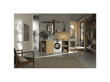 Charger l&#39;image dans la galerie, Une buanderie moderne avec un sèche-linge, des étagères en bois, une plante en pot, un tapis et une chaise en bois avec un coussin.
