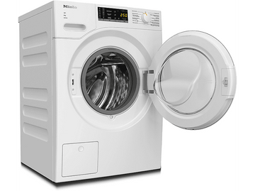 Lave-linge Miele blanc avec porte ouverte, commandes et affichage numérique.