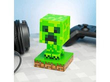 Charger l&#39;image dans la galerie, Figurine lumineuse Creeper de Minecraft verte. La base est verte et le visage est pixélisé.

