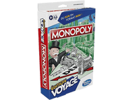 Boîte de jeu de société Monopoly. Présente l'homme Monopoly, des figurines de voiture et de chien argentées.