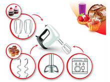 Charger l&#39;image dans la galerie, Mixeur à main blanc avec accessoires, petits gâteaux, pain et jus.
