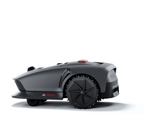 Charger l&#39;image dans la galerie, Une tondeuse robotique gris foncé avec une roue est montrée sur fond blanc.
