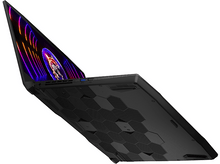 Charger l&#39;image dans la galerie, Un ordinateur portable noir avec l&#39;écran ouvert, affichant des graphiques colorés. Le bas a un design en nid d&#39;abeille.
