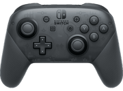 Une manette Nintendo Switch Pro gris foncé. Boutons et joysticks visibles.