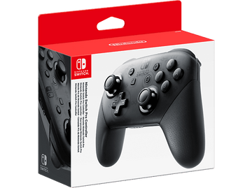 Manette Nintendo Switch Pro Controller dans une boîte. Manette noire avec boutons, joysticks et croix directionnelle.