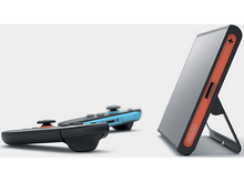 Charger l&#39;image dans la galerie, Composants Nintendo Switch. Un écran de tablette, deux manettes et un support. Fond blanc.
