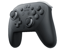Charger l&#39;image dans la galerie, Une manette Pro Nintendo Switch noire avec des boutons et des joysticks.
