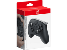 Charger l&#39;image dans la galerie, Une manette Nintendo Switch Pro Controller noire et grise dans une boîte rouge et blanche.
