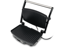 Charger l&#39;image dans la galerie, Gril à panini noir. La partie supérieure est ouverte, montrant la surface de cuisson rainurée. Poignée argentée.
