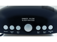 Charger l'image dans la galerie, Réveil noir avec des boutons, affichant le texte 'DIMMER HI/LOW SLEEP/SNOOZE'.
