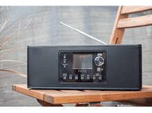 Charger l&#39;image dans la galerie, Radio noire sur une chaise en bois, avec écran.
