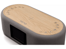 Charger l&#39;image dans la galerie, Haut-parleur ovale en bois avec une enveloppe en tissu. Il a des boutons sur le dessus et un petit écran.
