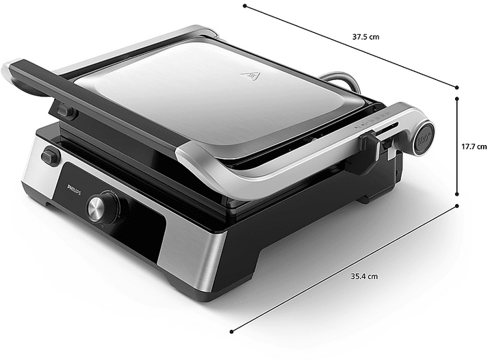 Presse à panini argent et noire. Couvercle ouvert. Dimensions : 37,5cm x 35,4cm x 17,7cm. Marque Philips.