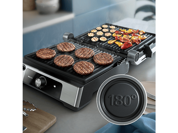 Gril électrique avec hamburgers et légumes grillés, design noir et argent.
