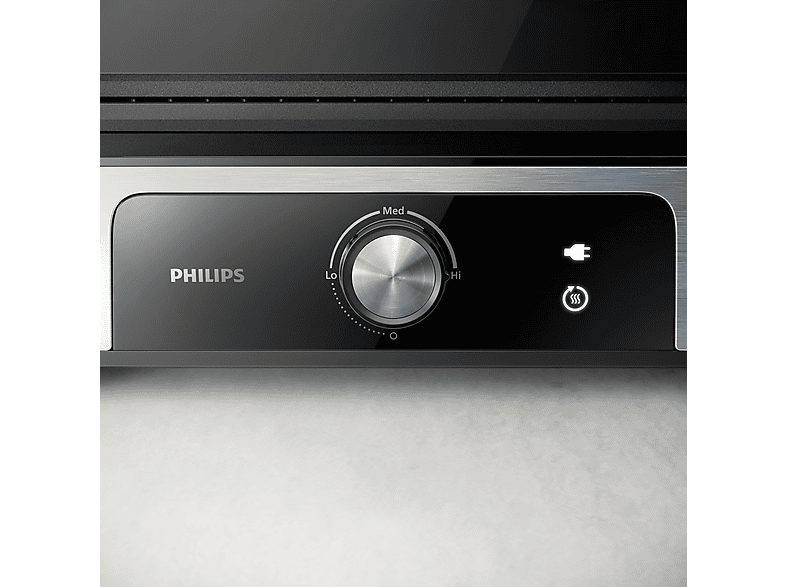Gros plan sur le panneau de contrôle d'un grill Philips avec cadran et indicateur.