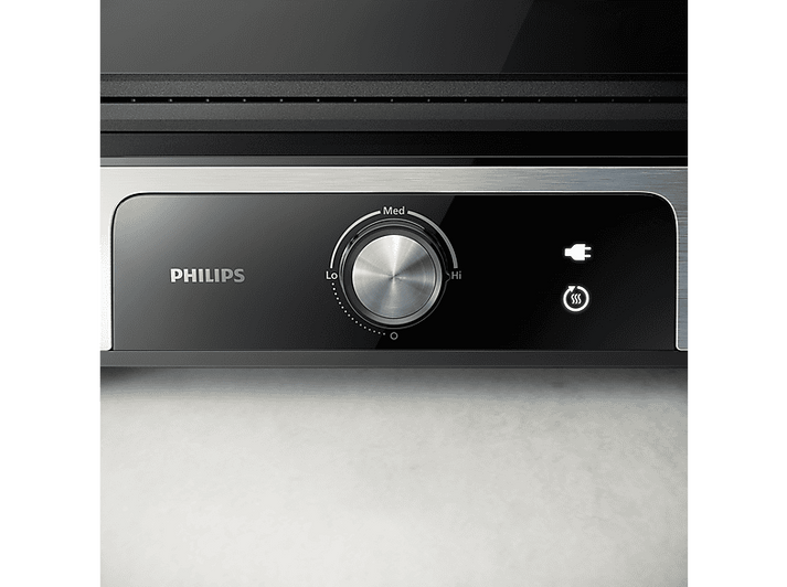 Gros plan sur le panneau de contrôle d'un grill Philips avec cadran et indicateur.