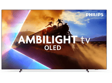 Charger l&#39;image dans la galerie, Un écran de télévision affichant une scène de train avec des personnes au-dessus, avec le logo Philips et Ambilight visible.
