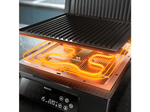 Charger l&#39;image dans la galerie, Gril Philips noir avec couvercle ouvert. Éléments chauffants orange vif visibles. Affichage numérique en façade.
