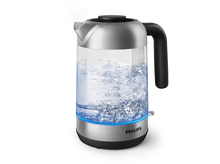 Charger l&#39;image dans la galerie, Une bouilloire électrique en acier inoxydable et en verre avec une lumière bleue.
