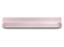 Charger l&#39;image dans la galerie, Un étui rose pour une brosse à dents.
